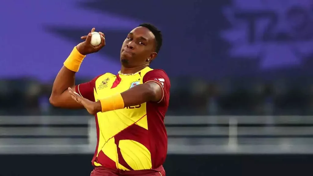 In this November 6, 2021 file photo, West Indies' Dwayne Bravo bowls during the ICC men's Twenty20 World Cup match against Australia and West Indies at the Sheikh Zayed Cricket Stadium in Abu Dhabi. -
